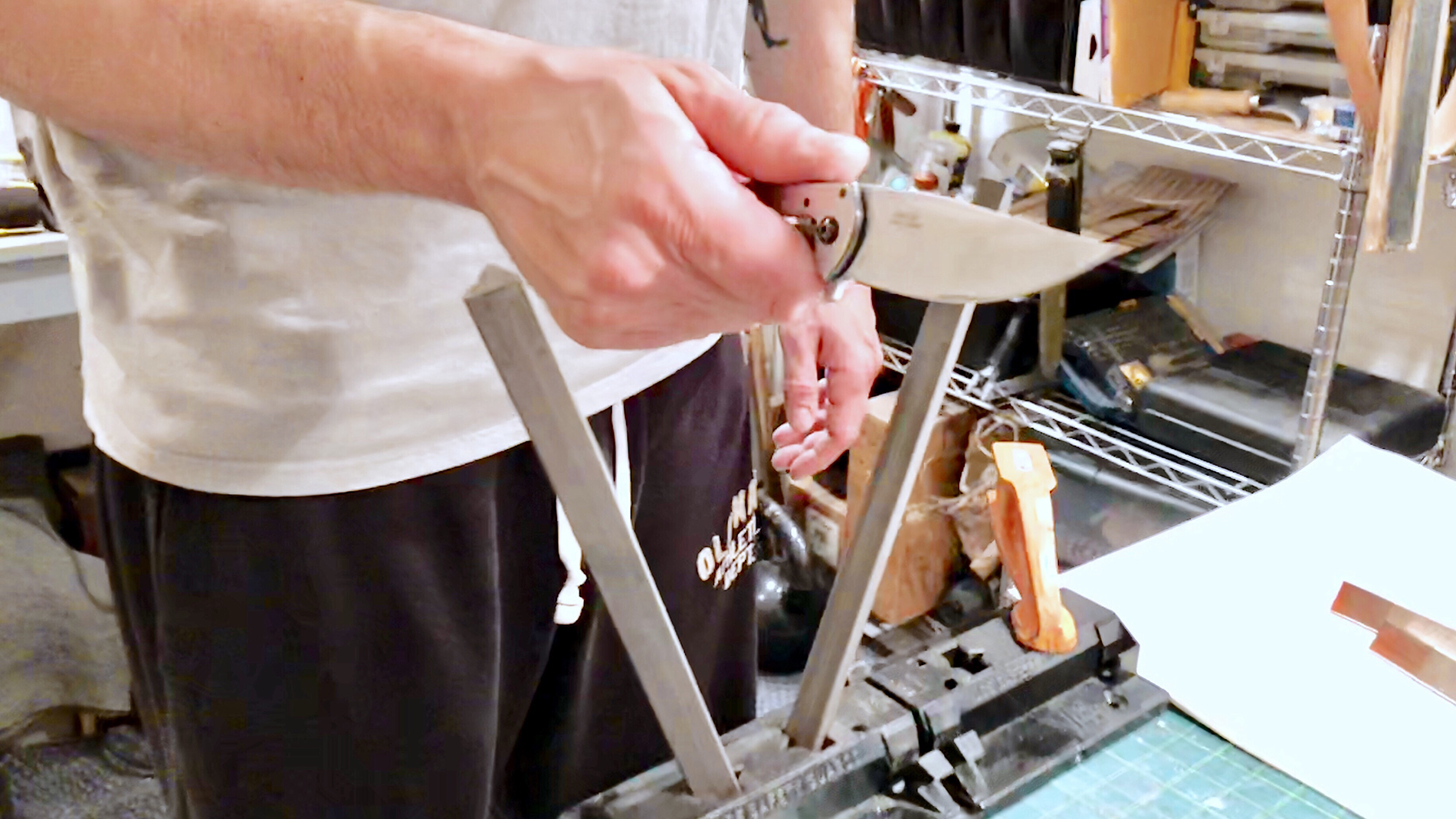 a-knife-making-hobbyist-hand-sharpens-a-knife-blad-2022-11-16-17-04-35-utc